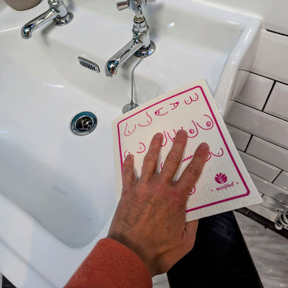 wiping sink with breast cancer awareness swedish dish cloths